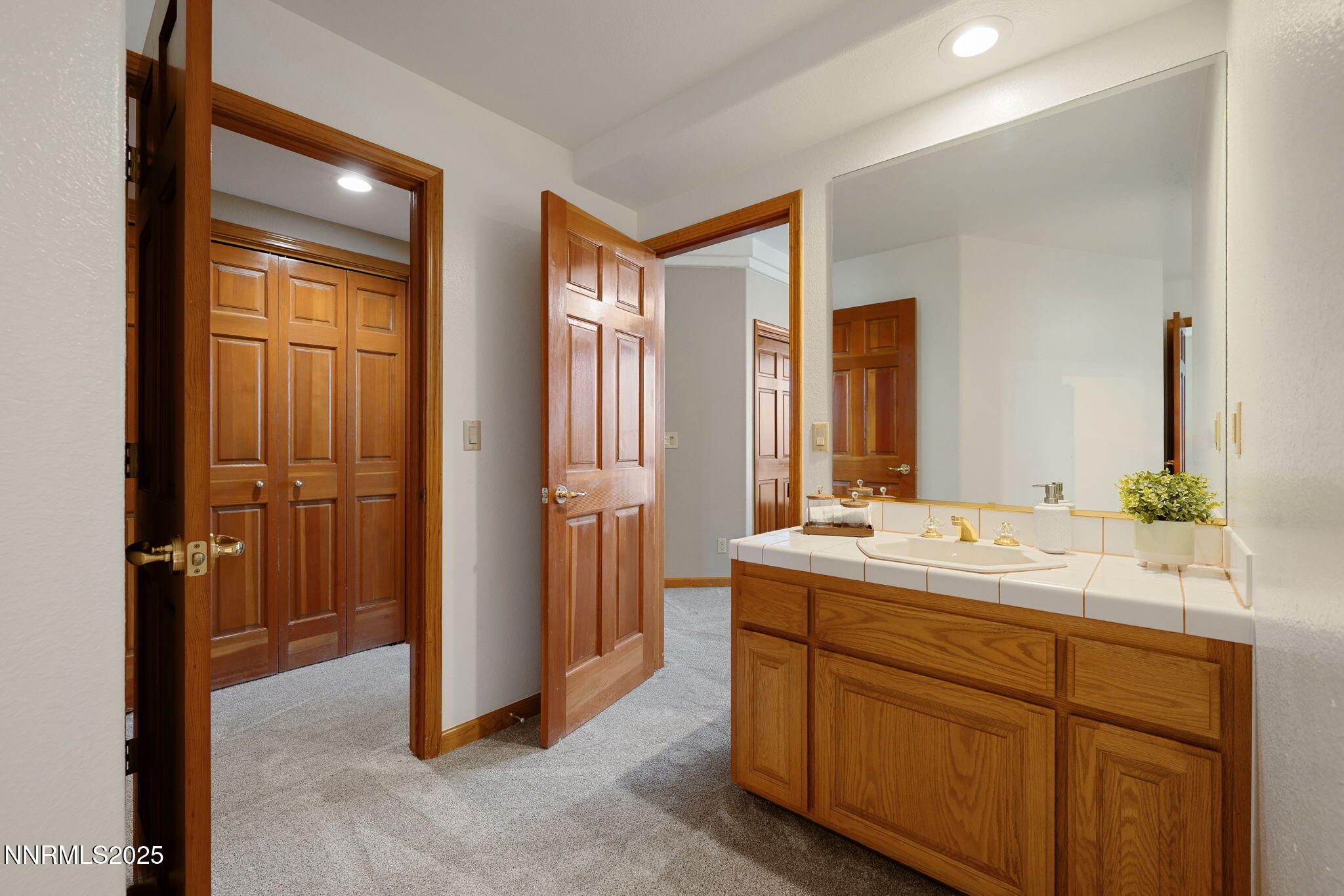 1205 Greensburg Circle Reno, NV 89509 - Photo 30 of 41 a spacious bathroom with a double vanity sink a mirror and a shower