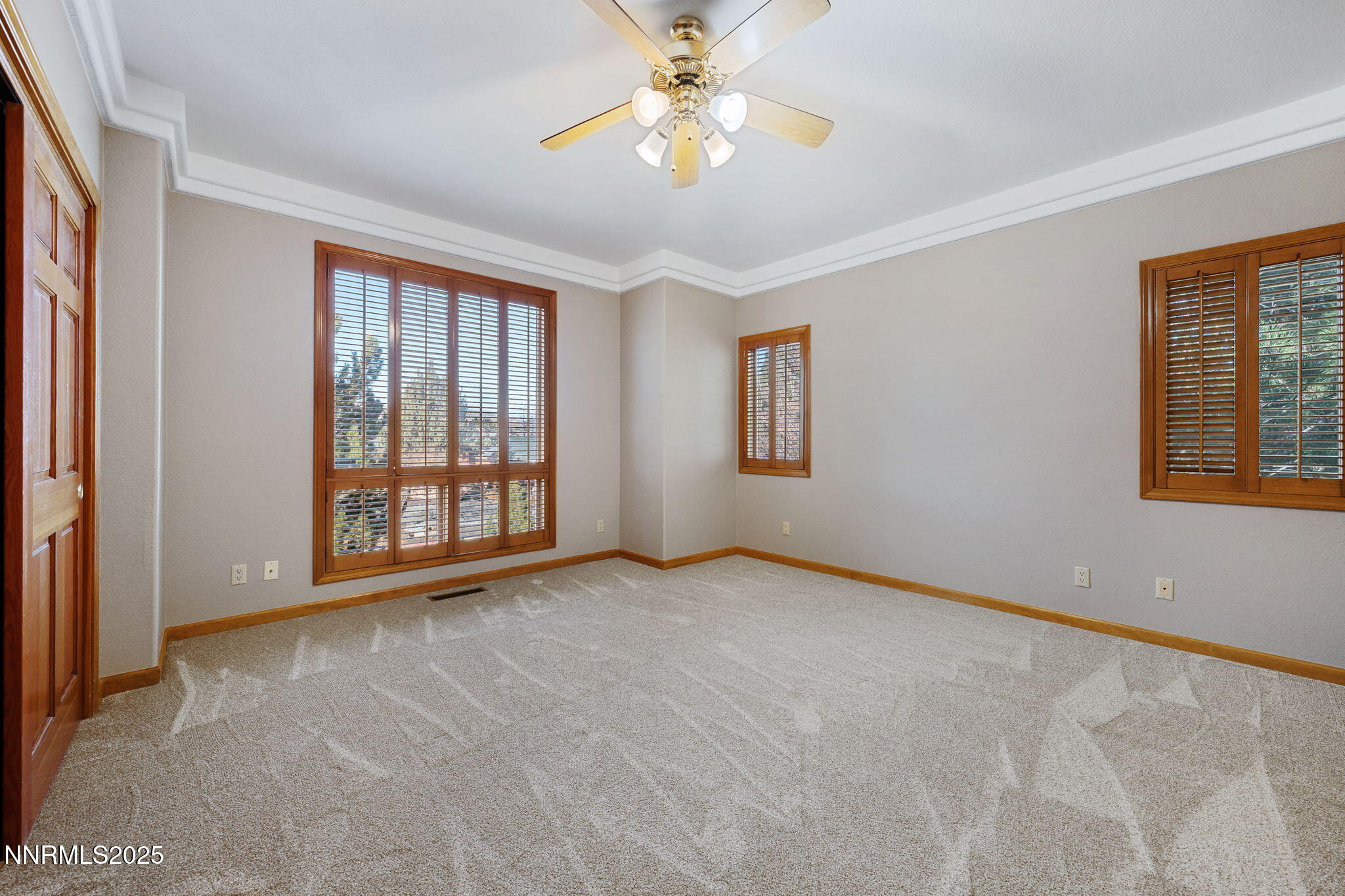 1205 Greensburg Circle Reno, NV 89509 - Photo 35 of 41 a view of an empty room with window and chandelier fan