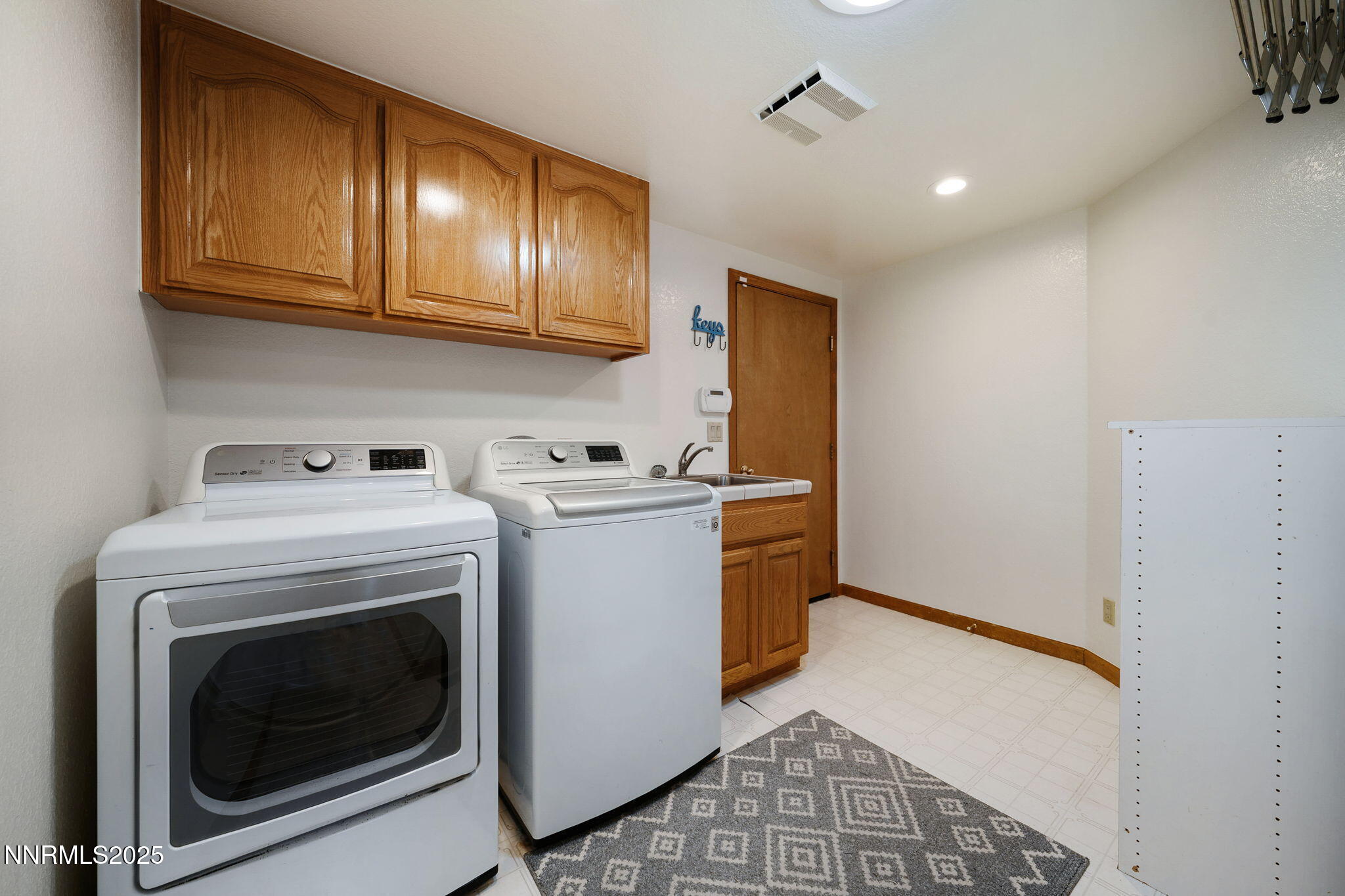 1205 Greensburg Circle Reno, NV 89509 - Photo 36 of 41 a utility room with dryer and washer