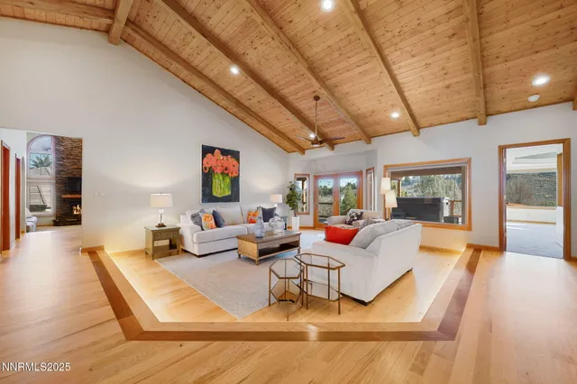 a living room with lots of furniture and white walls