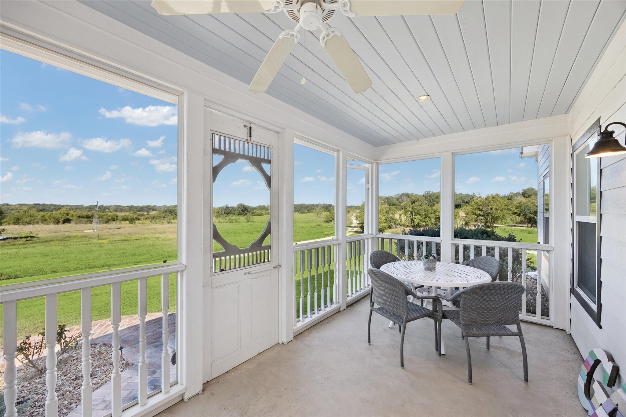 5100 Jaeger Road Burton, TX 77835 - Photo 23 of 34 Sunroom with ceiling fan and outdoor dining space