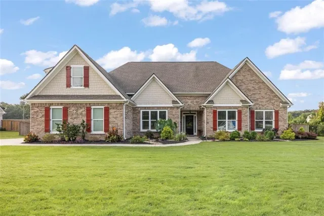 a front view of a house with garden