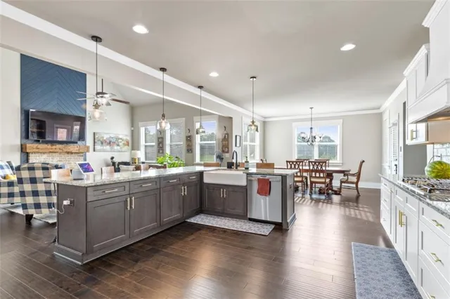 a kitchen with lots of counter top space and dining table