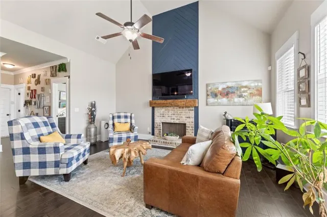 a living room with furniture fireplace and a flat screen tv