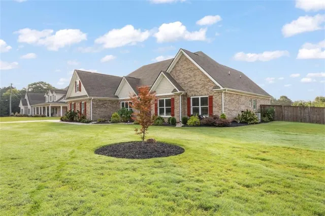 a house with swimming pool in front of it
