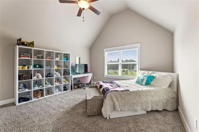 a bedroom with a bed furniture and a window