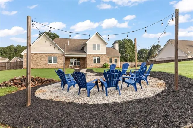 a view of a house with backyard porch and patio