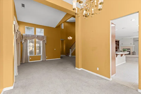 a kitchen with stainless steel appliances granite countertop refrigerator sink stove and oven
