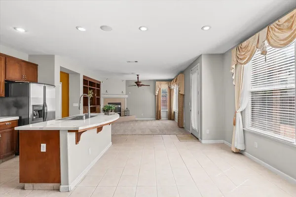 a kitchen with stainless steel appliances granite countertop a sink stove and cabinets
