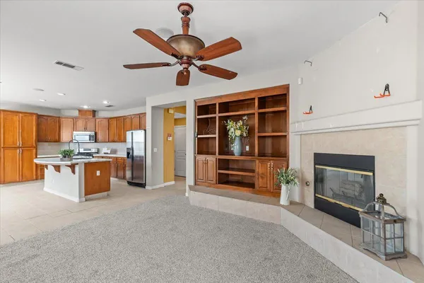 a bathroom with a granite countertop sink a mirror and a toilet