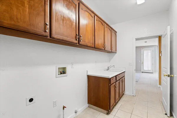 an empty room with a ceiling fan and a chandelier fan