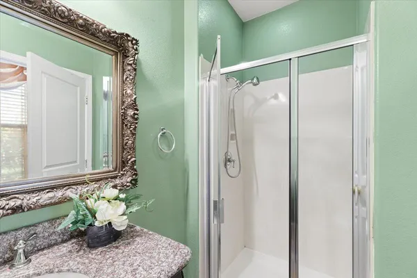 a view of a swimming pool with a yard and sitting area