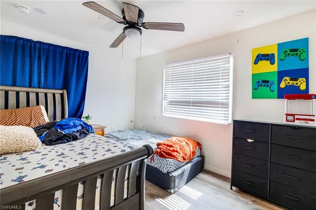 a bedroom with a bed and a dresser