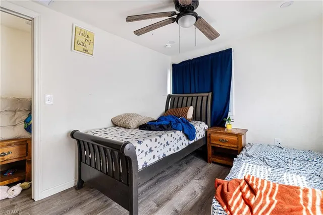 a bedroom with furniture and a window