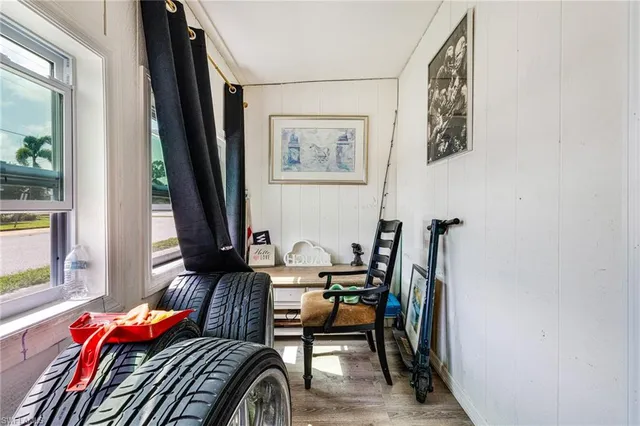 a bedroom with furniture and a window