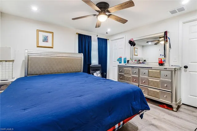 a bedroom with a bed and a cabinets