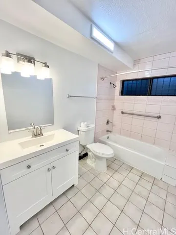 a bathroom with a double vanity sink mirror and toilet
