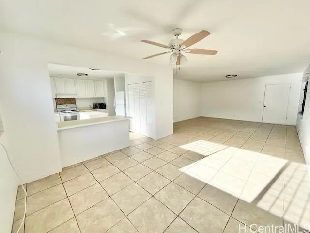 a view of a kitchen with kitchen sink and cabinets