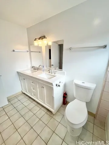 a bathroom with a sink toilet and mirror