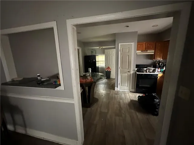 a kitchen with a refrigerator and a stove