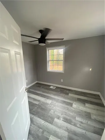 a kitchen with stainless steel appliances kitchen island granite countertop a refrigerator and a stove top oven