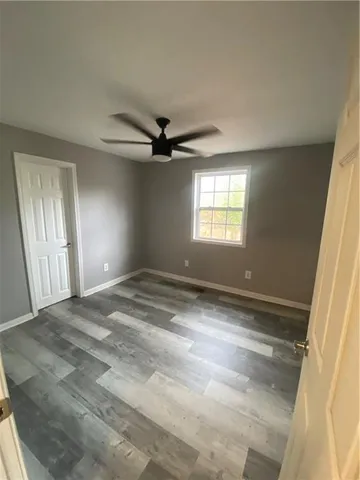 a kitchen with stainless steel appliances granite countertop a sink stove and microwave