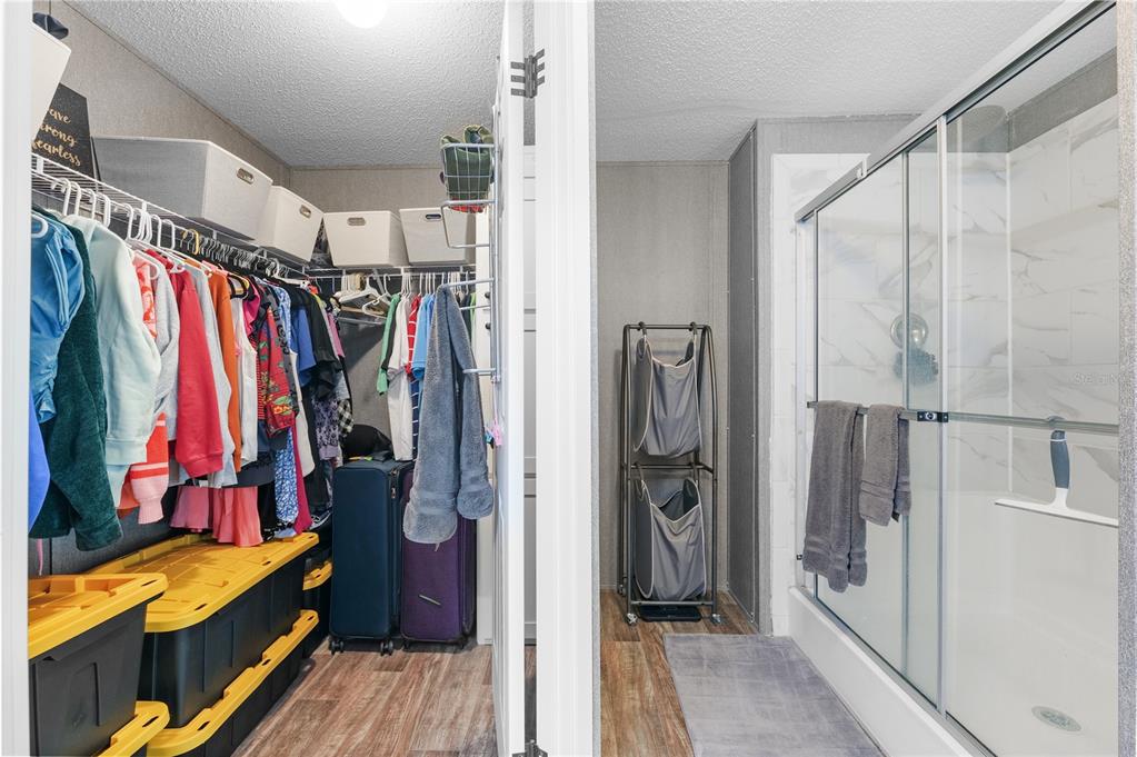 18625 Deason Drive Spring Hill, FL 34610 - Photo 18 of 35 a view of walk in closet with clothes