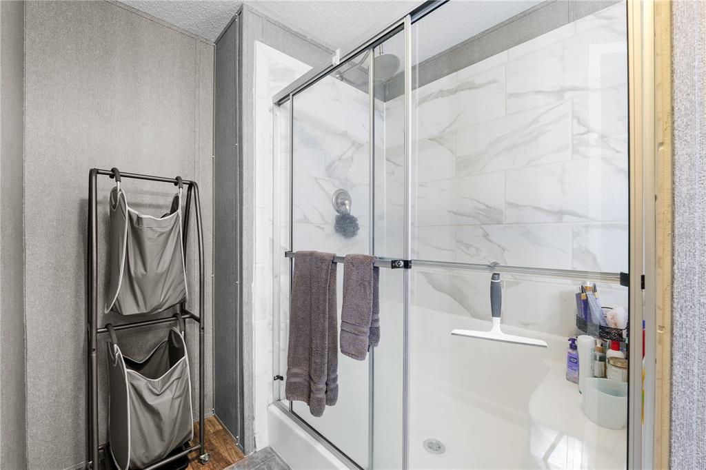 18625 Deason Drive Spring Hill, FL 34610 - Photo 19 of 35 a bathroom with a shower