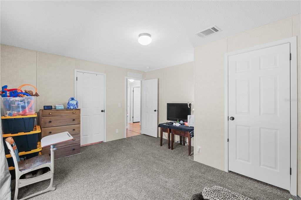 18625 Deason Drive Spring Hill, FL 34610 - Photo 25 of 35 a view of a workspace with furniture and a cabinet