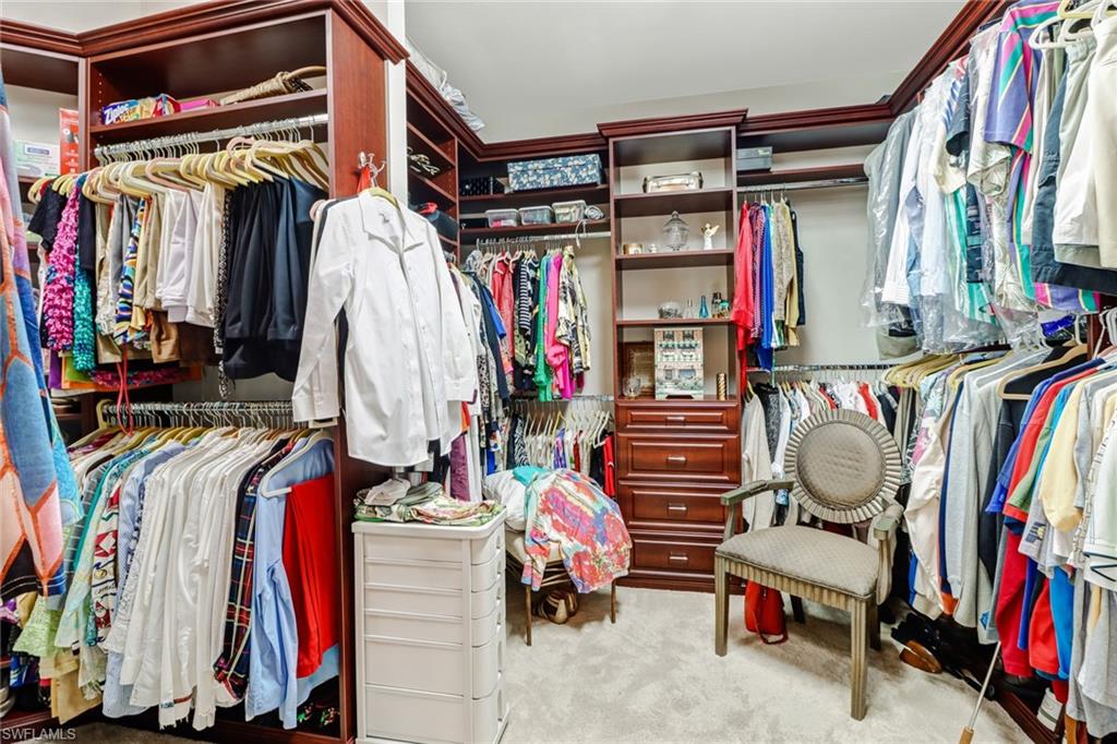 8633 Julia Lane Naples, FL 34114 - Photo 14 of 26 a view of walk in closet with clothes