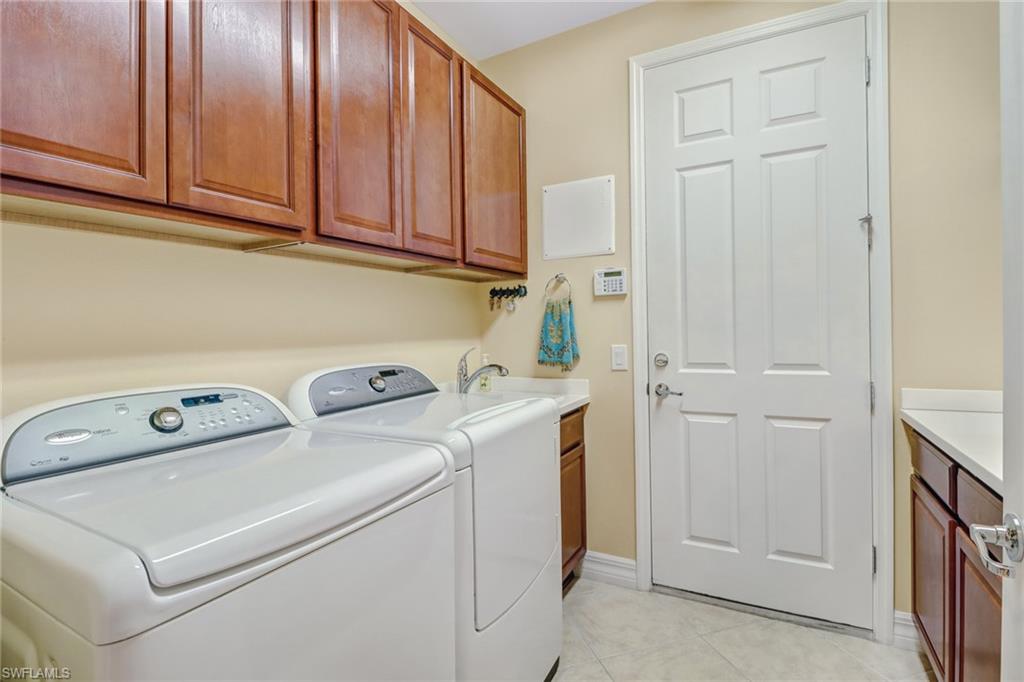 8633 Julia Lane Naples, FL 34114 - Photo 20 of 26 a utility room with dryer and washer