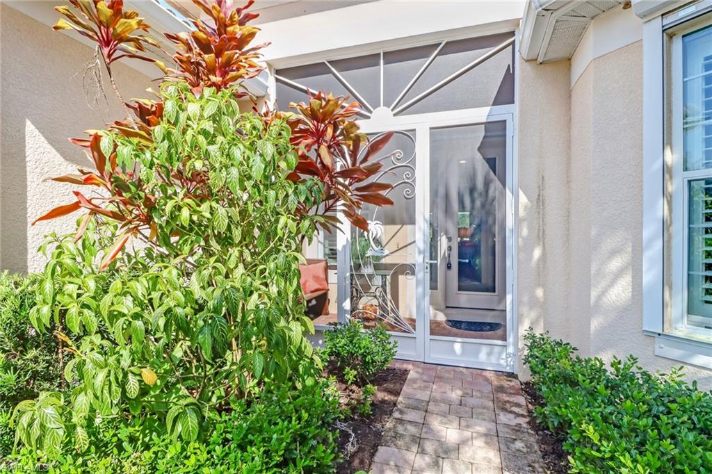 8633 Julia Lane Naples, FL 34114 - Photo 2 of 26 a view of a back yard of the house