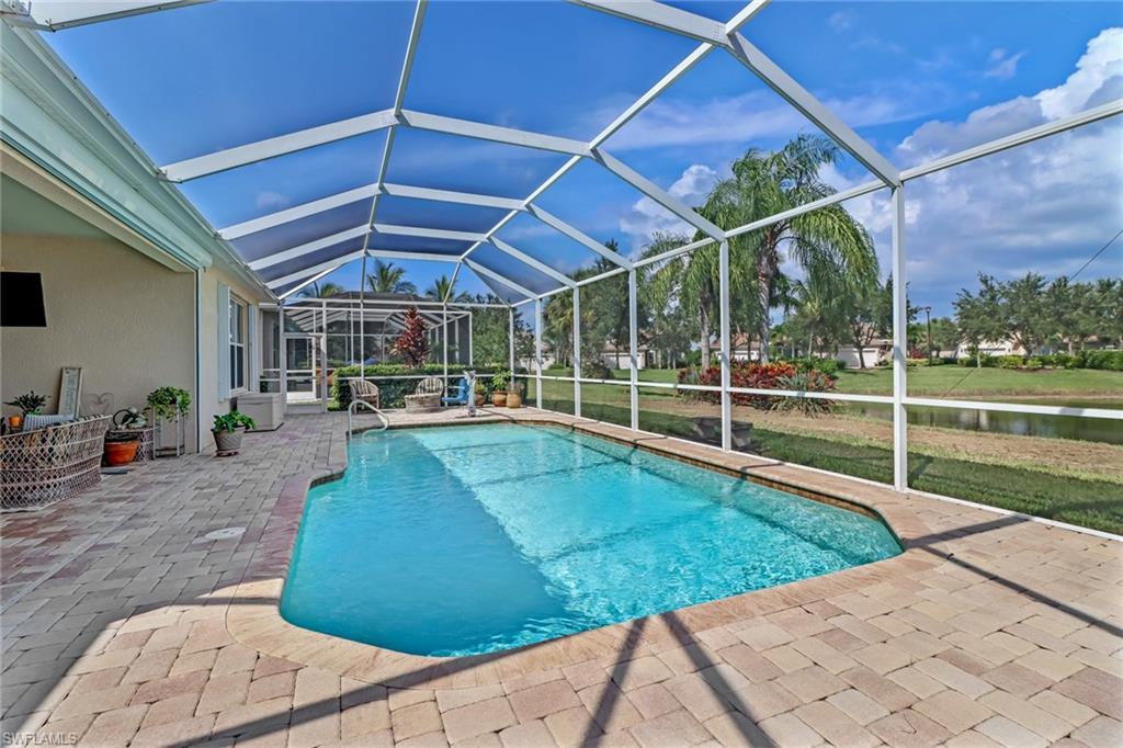 8633 Julia Lane Naples, FL 34114 - Photo 21 of 26 a view of a backyard with swimming pool