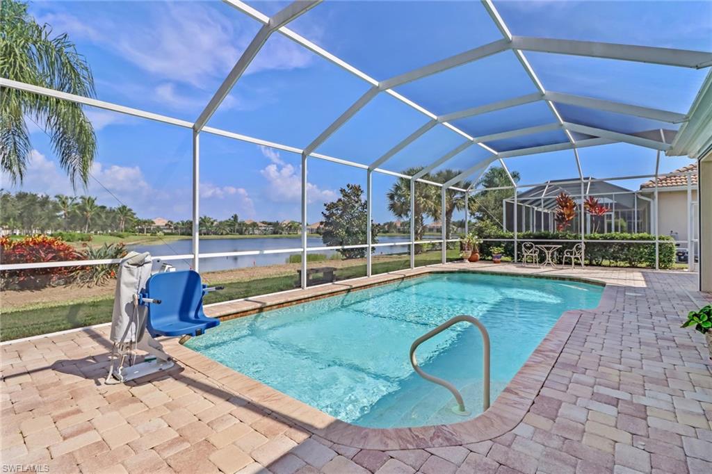 8633 Julia Lane Naples, FL 34114 - Photo 22 of 26 a view of a swimming pool with a patio