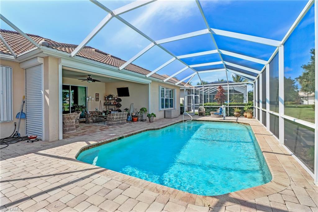 8633 Julia Lane Naples, FL 34114 - Photo 23 of 26 a view of a backyard with swimming pool