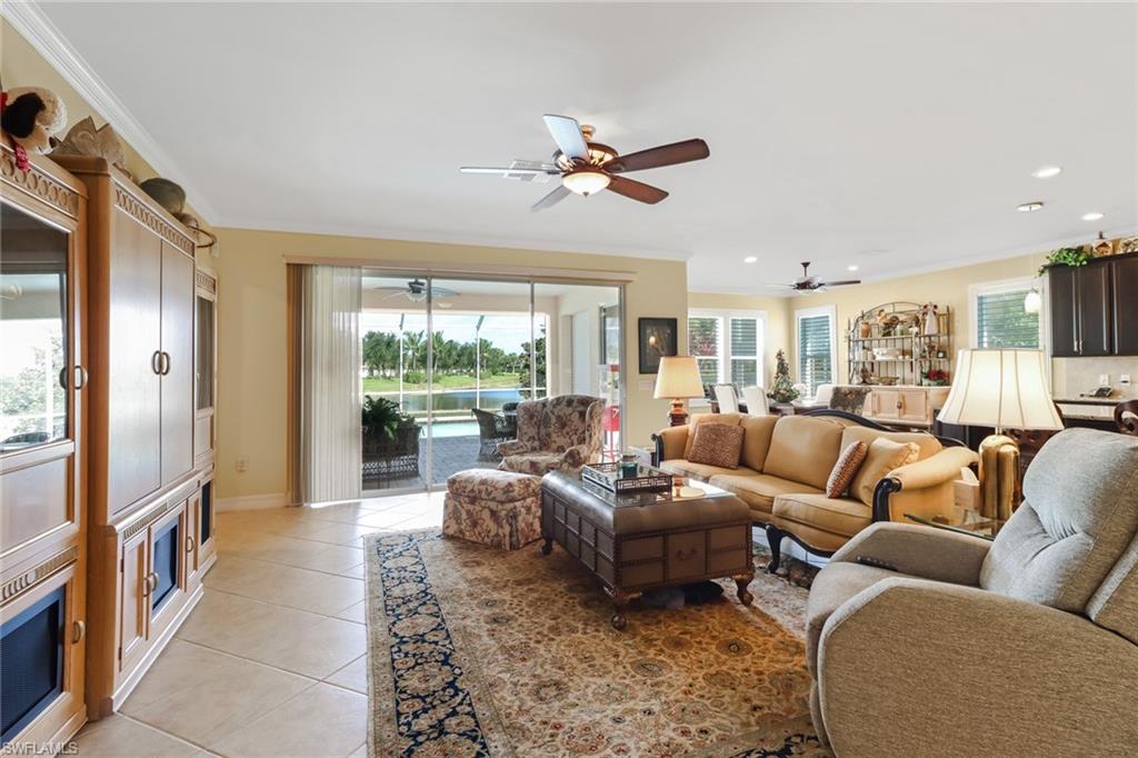 8633 Julia Lane Naples, FL 34114 - Photo 8 of 26 a living room with furniture and a large window