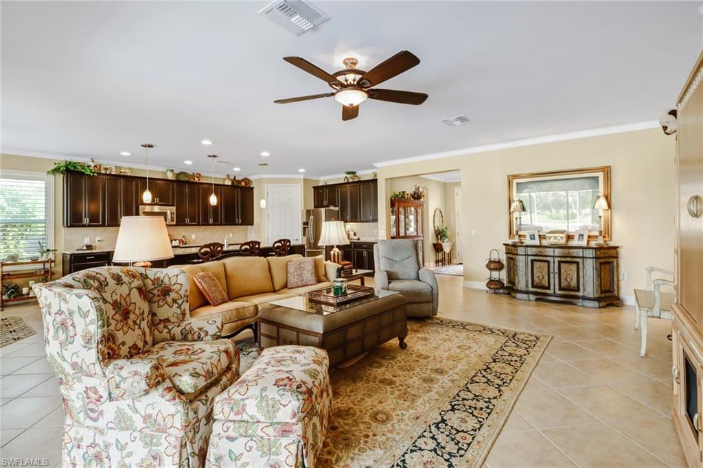 8633 Julia Lane Naples, FL 34114 - Photo 9 of 26 a living room with furniture kitchen view and a window