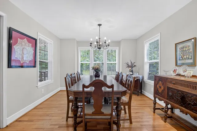 a view of a deck with chairs and wooden floor