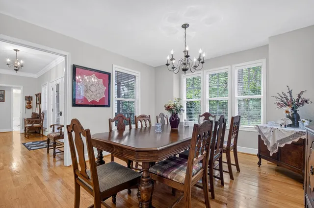 a view of balcony with wooden floor and outdoor seating