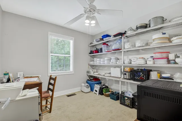 a bedroom with bed and a window