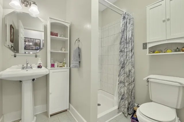 a bathroom with a sink double vanity and a mirror