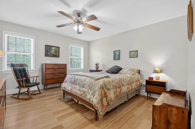a spacious bathroom with a double vanity sink a mirror and a shower