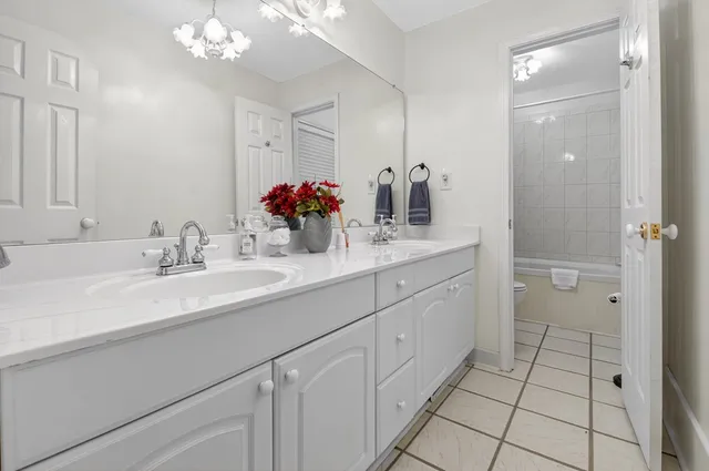 a view of a chairs and table in patio with wooden floor