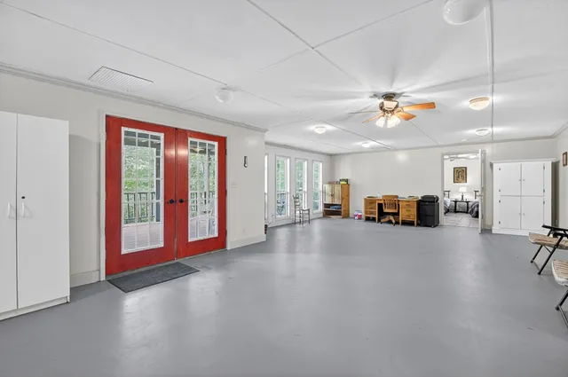 a view of house with a yard and sitting area