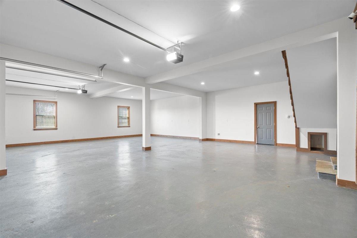 620 Diffee Road Moscow, TN 38057 - Photo 17 of 40 an empty room with wooden floor and windows