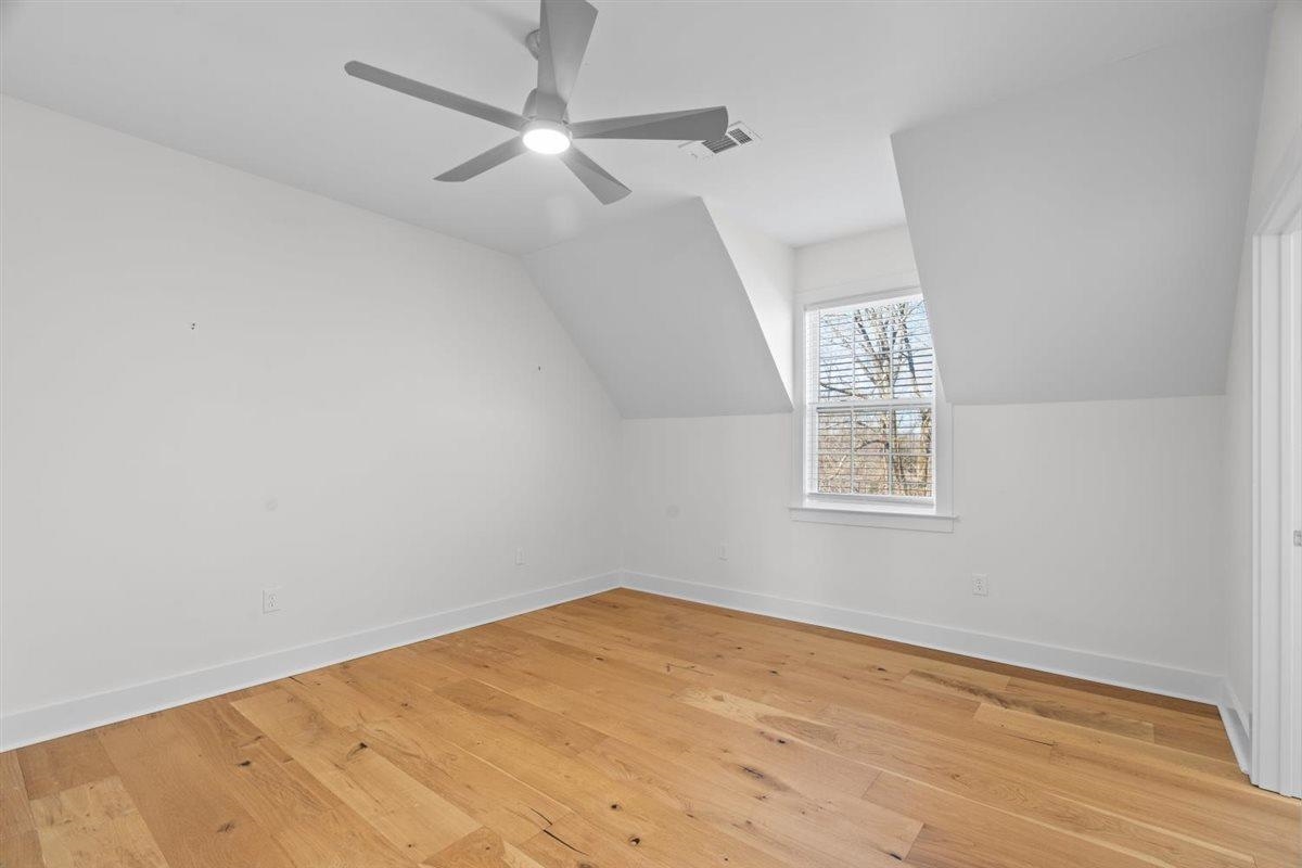 620 Diffee Road Moscow, TN 38057 - Photo 31 of 40 Additional living space featuring light wood-style floors, vaulted ceiling, and a ceiling fan