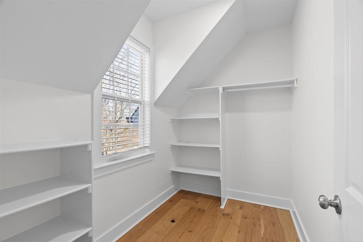 620 Diffee Road Moscow, TN 38057 - Photo 33 of 40 Walk in closet with light wood-type flooring and vaulted ceiling