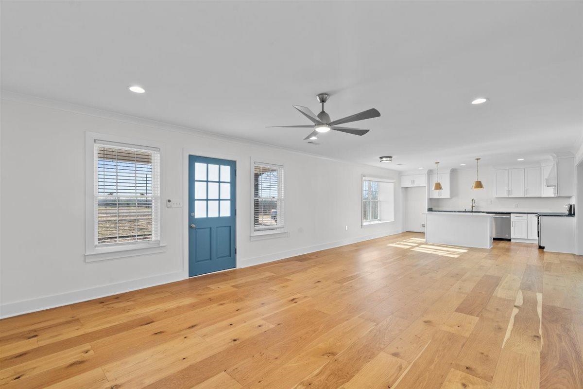 620 Diffee Road Moscow, TN 38057 - Photo 10 of 40 Unfurnished living room with light wood-style flooring, ornamental molding, a ceiling fan, and recessed lighting