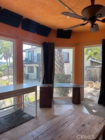 a view of a living room filled with furniture