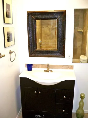 a bathroom with a sink and a mirror